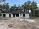 Newly constructed block home with a grey roof and covered porch at 5935 Nw 14Th St, Ocala, FL 34482