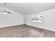 Living room with vinyl flooring and a large window at 6831 Se 53Rd Pl, Ocala, FL 34472