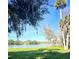 Scenic view of a tranquil lake surrounded by lush greenery at 7 Emerald Ct, Ocala, FL 34472