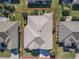 An aerial view showcasing a single-Gathering house with a beige roof in a residential neighborhood at 8852 Se 119Th St, Summerfield, FL 34491