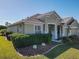 Single-story house with green exterior and well-manicured landscaping at 8852 Se 119Th St, Summerfield, FL 34491