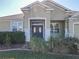Inviting front entry with double doors and landscaping at 8852 Se 119Th St, Summerfield, FL 34491