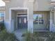 Front entry featuring double doors and a covered porch at 8852 Se 119Th St, Summerfield, FL 34491