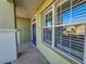 Front porch with view of entry door and windows at 8852 Se 119Th St, Summerfield, FL 34491
