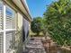 Pathway beside house, with well-maintained landscaping at 8852 Se 119Th St, Summerfield, FL 34491