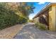 Landscaped backyard with gravel pathway and screened patio at 9015 Sw 86Th Loop, Ocala, FL 34481