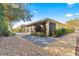 Landscaped backyard with gravel pathway and screened porch at 9015 Sw 86Th Loop, Ocala, FL 34481