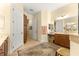 Large bathroom with double vanity, walk-in shower, and ample storage at 9015 Sw 86Th Loop, Ocala, FL 34481