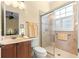 Well-appointed bathroom with shower, toilet, and vanity at 9015 Sw 86Th Loop, Ocala, FL 34481