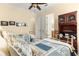 Cozy bedroom with twin beds, built-in shelving, and access to bathroom at 9015 Sw 86Th Loop, Ocala, FL 34481