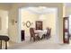 Formal dining room with a chandelier, hardwood floors, and large windows at 9015 Sw 86Th Loop, Ocala, FL 34481