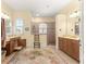 Hallway with tile flooring, a mirror and a small table at 9015 Sw 86Th Loop, Ocala, FL 34481