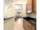 View of kitchen with granite countertops and wood cabinets at 9015 Sw 86Th Loop, Ocala, FL 34481