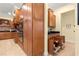 Organized kitchen with ample wood cabinetry and pull-out shelving at 9015 Sw 86Th Loop, Ocala, FL 34481