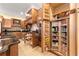 Well-organized kitchen with pull-out shelving and a large pantry at 9015 Sw 86Th Loop, Ocala, FL 34481