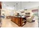 Open concept kitchen with large island, granite counters, and stainless steel appliances at 9015 Sw 86Th Loop, Ocala, FL 34481