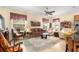Spacious living room featuring comfortable seating and a large area rug at 9015 Sw 86Th Loop, Ocala, FL 34481