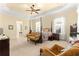 Primary bedroom with a post bed and comfortable seating area at 9015 Sw 86Th Loop, Ocala, FL 34481