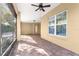 Spacious screened porch with brick tile floor and ceiling fan at 9015 Sw 86Th Loop, Ocala, FL 34481
