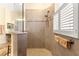 Large walk-in shower with tile surround and built-in seat at 9015 Sw 86Th Loop, Ocala, FL 34481
