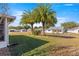 Backyard with mature palm trees and homes at 9158 Sw 91St Ter, Ocala, FL 34481