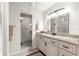 Updated bathroom with granite vanity, walk-in shower, and tile flooring at 9158 Sw 91St Ter, Ocala, FL 34481