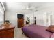 Comfortable bedroom with dresser and ceiling fan, near bathroom at 9158 Sw 91St Ter, Ocala, FL 34481