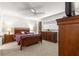 Spacious bedroom with wood furniture and ceiling fan at 9158 Sw 91St Ter, Ocala, FL 34481
