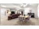 Bright dining area with table and chairs, adjacent to living room at 9158 Sw 91St Ter, Ocala, FL 34481