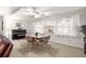 Spacious dining room features large window and seating for four at 9158 Sw 91St Ter, Ocala, FL 34481