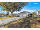 Single story home with attached garage and well manicured lawn at 9158 Sw 91St Ter, Ocala, FL 34481