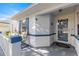 Front entrance with a glass door and welcome mat at 9158 Sw 91St Ter, Ocala, FL 34481