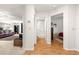 Clean hallway with wood-look flooring, leading to bathroom and bedroom at 9158 Sw 91St Ter, Ocala, FL 34481