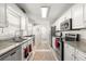 Updated kitchen boasts stainless steel appliances and ample cabinet space at 9158 Sw 91St Ter, Ocala, FL 34481