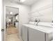 Laundry room with washer, dryer, and overhead shelving at 9158 Sw 91St Ter, Ocala, FL 34481