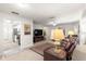 Open concept living room with a view into the kitchen at 9158 Sw 91St Ter, Ocala, FL 34481