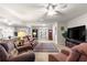 Living room with a view into the dining area and kitchen at 9158 Sw 91St Ter, Ocala, FL 34481