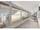 Long screened porch with view of backyard at 9158 Sw 91St Ter, Ocala, FL 34481