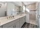 Double vanity bathroom with a large walk-in shower at 10406 Sw 96 Loop, Ocala, FL 34481