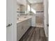 Double vanity bathroom with large walk-in shower and neutral tile at 10406 Sw 96 Loop, Ocala, FL 34481