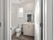 Clean bathroom with single vanity, toilet, and bathtub at 10406 Sw 96 Loop, Ocala, FL 34481