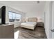 Bright bedroom with a king-size bed and large windows at 10406 Sw 96 Loop, Ocala, FL 34481