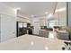 Modern kitchen with stainless steel appliances and white cabinets at 10406 Sw 96 Loop, Ocala, FL 34481