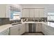 Modern kitchen with stainless steel appliances and corner sink at 10406 Sw 96 Loop, Ocala, FL 34481