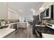 Modern kitchen with stainless steel appliances and ample counter space at 10406 Sw 96 Loop, Ocala, FL 34481