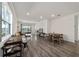 Open living area with hardwood floors and sliding glass doors at 10406 Sw 96 Loop, Ocala, FL 34481