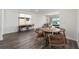 Living room features wood flooring and a view to backyard at 10406 Sw 96 Loop, Ocala, FL 34481