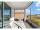 Screened porch with table and chairs at 10406 Sw 96 Loop, Ocala, FL 34481