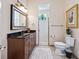 Bathroom with granite countertop, large mirror and walk-in shower at 3000 Nw 79Th Avenue Rd, Ocala, FL 34482
