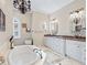 Large bathroom with and sinks, soaking tub and walk-in shower at 3000 Nw 79Th Avenue Rd, Ocala, FL 34482
